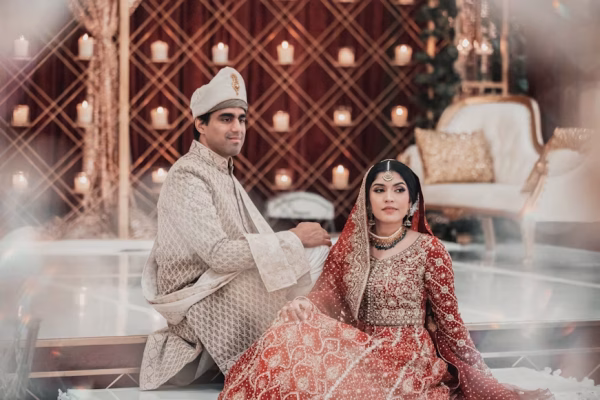 Wedding photoshoot couple laughing under Lahore wedding décor