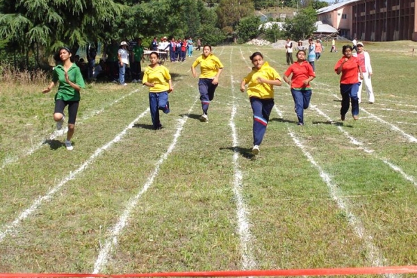 Students participating in a running race at the… Students participating in a running race at the…